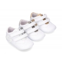 Tennis style shoes for babies with hook and loop strap in soft leather combined with patent leather.