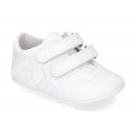 Tennis style shoes for babies with hook and loop strap in soft leather combined with patent leather.