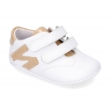 Tennis style shoes for babies with hook and loop strap in soft leather combined with patent leather.