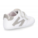 Tennis style shoes for babies with hook and loop strap in soft leather combined with patent leather.