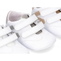 Tennis style shoes for babies with hook and loop strap in soft leather combined with patent leather.