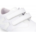 Tennis style shoes for babies with hook and loop strap in soft leather combined with patent leather.