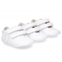 Tennis style shoes for babies with hook and loop strap in soft leather combined with patent leather.