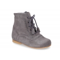 Classic Pascuala style ankle boots with ties with TASSELS in suede leather.