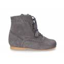 Classic Pascuala style ankle boots with ties with TASSELS in suede leather.
