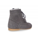 Classic Pascuala style ankle boots with ties with TASSELS in suede leather.