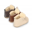 Little Safari boots for babies with ties closure and wool knit lining.