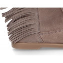 Suede leather boot shoes with fringed design.