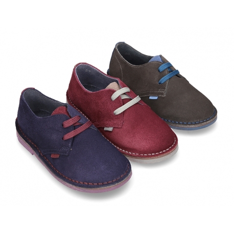 New Classic suede leather Laces up shoes with combined tongue and soles.