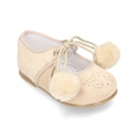Suede leather little classic Mary jane shoes with POMPONS ties closure.