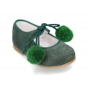 Suede leather little classic Mary jane shoes with POMPONS ties closure.