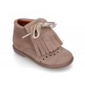 Classic suede leather little bootie with fringed design.