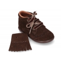 Classic suede leather little bootie with fringed design.