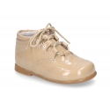 Classic patent leather English style bootie for first steps in pastel colors.