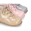 Classic patent leather English style bootie for first steps in pastel colors.