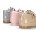 Classic patent leather English style bootie for first steps in pastel colors.