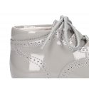 Classic patent leather English style bootie for first steps in pastel colors.