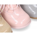 Classic patent leather English style bootie for first steps in pastel colors.