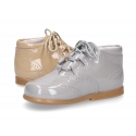 Classic patent leather English style bootie for first steps in pastel colors.