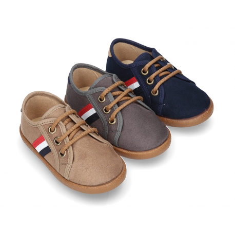 Autumn winter canvas tennis style shoes with flag detail.