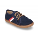 Tenis en Serratex con bandera lateral y cordones.