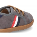 Autumn winter canvas tennis style shoes with flag detail.