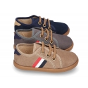 Autumn winter canvas tennis style shoes with flag detail.