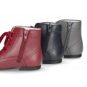 Classic Nappa leather Pascuala style ankle boots with waves in dark colors.