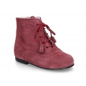 Classic suede leather in dark colors Pascuala styel ankle boots with tassels.