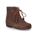 Classic suede leather in dark colors Pascuala styel ankle boots with tassels.