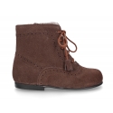 Classic suede leather in dark colors Pascuala styel ankle boots with tassels.