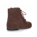 Classic suede leather in dark colors Pascuala styel ankle boots with tassels.