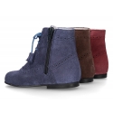 Classic suede leather in dark colors Pascuala styel ankle boots with tassels.