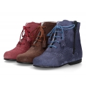 Classic suede leather in dark colors Pascuala styel ankle boots with tassels.