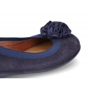 Suede leather ballet flat shoes with elastic band and flower design.