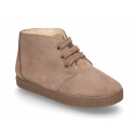 New suede leather little bootie sneaker style with fake hair lining.