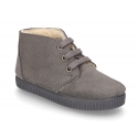 New suede leather little bootie sneaker style with fake hair lining.