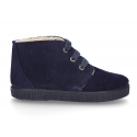 New suede leather little bootie sneaker style with fake hair lining.