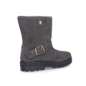 Suede leather boots with buckle design and zipper closure.