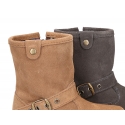 Suede leather boots with buckle design and zipper closure.