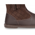 Washable leather boots combined with padded suede leather with tassels design.
