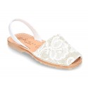 New Menorquina sandals with rear strap in pearl nappa leather with laces design.