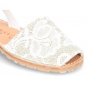 New Menorquina sandals with rear strap in pearl nappa leather with laces design.