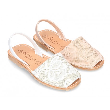 New Menorquina sandals with rear strap in pearl nappa leather with laces design.