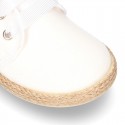 Special CEREMONY laces up shoes espadrille style with ties closure.