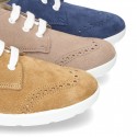 Classic suede leather Laces up shoes tennis style with ties closure and perforated design.