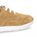 Classic suede leather Laces up shoes tennis style with ties closure and perforated design.