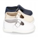 Little Washable leather T-strap shoes with buckle fastening.