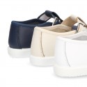 Little Washable leather T-strap shoes with buckle fastening.