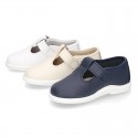 Little Washable leather T-strap shoes with buckle fastening.